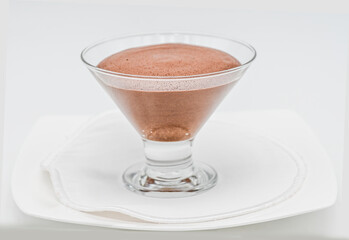 Chocolate mousse  on a white plate ready to serve,  chocolate mousse