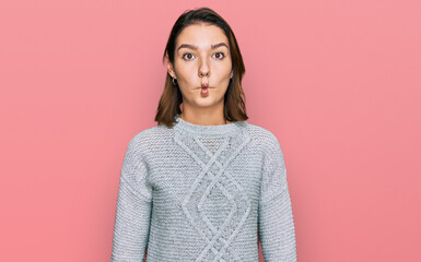 Fototapeta premium Young caucasian girl wearing casual clothes making fish face with lips, crazy and comical gesture. funny expression.