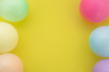 Happy birthday background, Flat lay colorful party decoration on pastel yellow background.