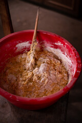 mixing flour with egg and milk by the housewife. preparing ingredients for traditional homemade cakes