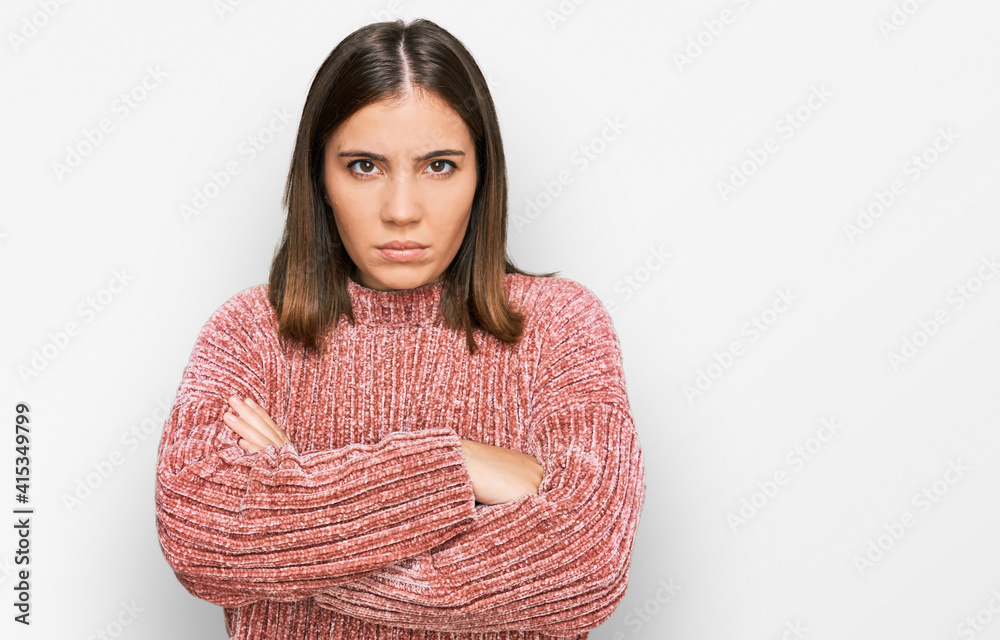 Sticker Young beautiful woman wearing casual clothes skeptic and nervous, disapproving expression on face with crossed arms. negative person.