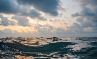 Sea surface, abstract closeup low angle view from swimming person point of view, morning overcast...