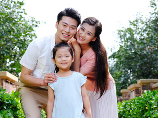 Happy family of three in the outdoor group photo