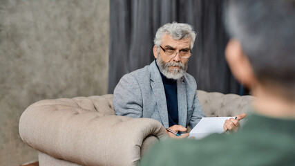 Professional psychoanalyst listening to depressed man