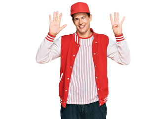 Handsome caucasian man wearing baseball uniform showing and pointing up with fingers number nine while smiling confident and happy.