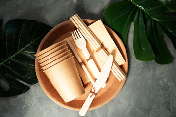 Fototapeta na wymiar Natural eco-friendly bamboo and paper tableware. Recycling concept.
