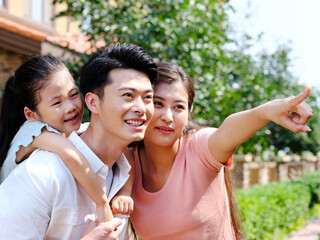 Happy family of three in the outdoor group photo