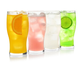 Delicious refreshing drinks in glasses on white background