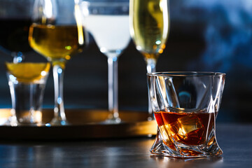 Glass of alcoholic drink on table, closeup. Space for text