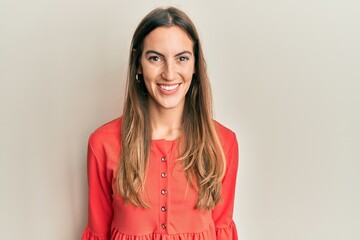 Obraz premium Young beautiful woman wearing casual clothes with a happy and cool smile on face. lucky person.