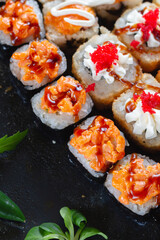 Sushi rolls with sauce close-up
