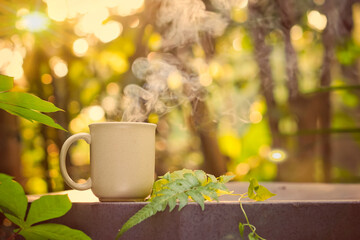 having fun while enjoying a hot cup of coffee outdoors