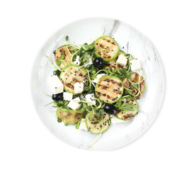 Delicious salad with grilled zucchini slices, feta cheese and olives on white background, top view