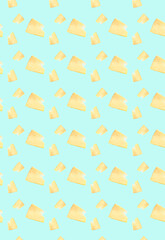 Vertical pattern with cut pieces of cheese on a blue background. Grocery background.