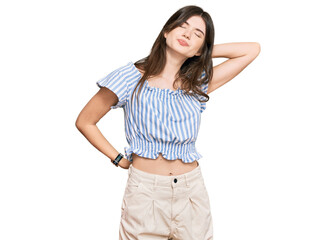 Young beautiful caucasian girl wearing casual clothes suffering of neck ache injury, touching neck with hand, muscular pain