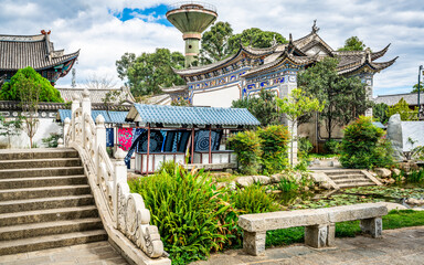 Scenic view of Dali Xizhou old town with ancient buildings stone bridge and water pond in Xizhou...