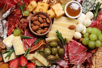 Tasty assorted appetizers as background, top view