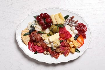 Assorted appetizers served on white wooden table, top view