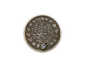 Rare medieval arabian silver coin on white background