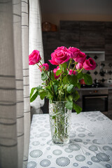 Beautiful flower bouquet of pink rose. Big bouquet of roses in vase on table.