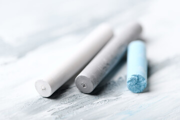  Soft pastels on bright wooden background. Close up.