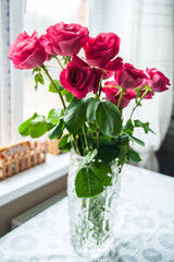 Beautiful flower bouquet of pink rose. Big bouquet of roses in vase on table.