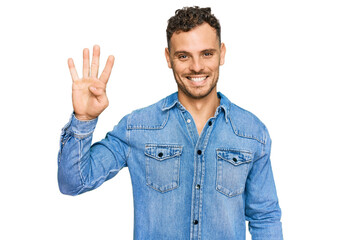 Young hispanic man wearing casual denim jacket showing and pointing up with fingers number four while smiling confident and happy.