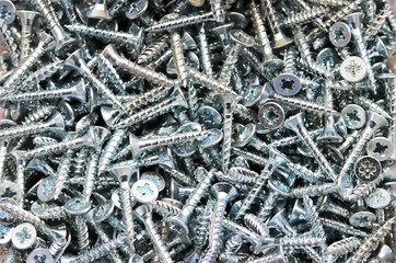 Mass of galvanised silver wood screws