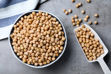 Raw chickpeas on grey table, flat lay