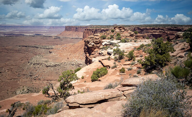 Fototapeta na wymiar Stupendous views of Canyonlands National Park from Dead Horse Point State Park in Utah on a partly cloudy day