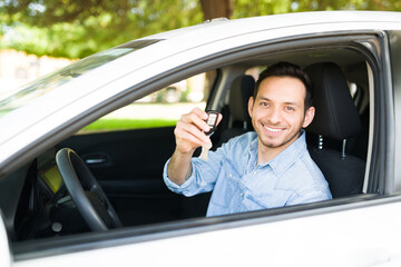 Attractive man feeling happy to buy a new car