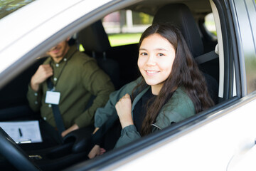 Cute teenage girl preparing for her driving lessons