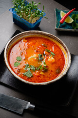 spicy asian soup with microgreens