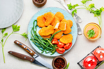 Nuggets with vegetable garnish