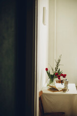 macro photo of a bouquet of tulips on the kitchen table along the white wall Scandinavian style