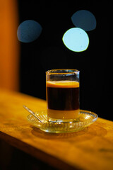 JENEPONTO INDONESIA 19 February 2020: Brew a mixture of coffee and milk in a glass at night