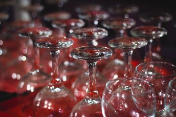 
wine glasses on a shelf in a bar