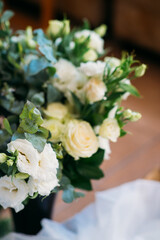 beautiful lush bouquet of white roses and eustomas for decorating a wedding celebration