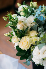 beautiful lush bouquet of white roses and eustomas for decorating a wedding celebration