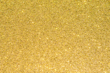 Gold glitter texture background sparkling shiny wrapping paper for Christmas holiday seasonal wallpaper  decoration, greeting and wedding invitation card design element