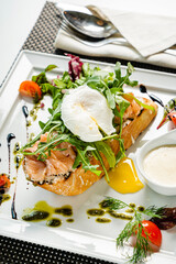 sandwich with salted salmon and poached egg