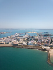 Drone panoramic view of Cadiz City. View of the south part of the city. In background the commercial harbour. Costa de Luz  - Spain
