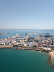 Fototapeta premium Drone panoramic view of Cadiz City. View of the south part of the city. In background the commercial harbour. Costa de Luz - Spain