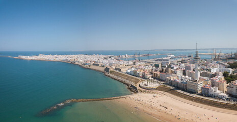 Fototapeta na wymiar Drone panoramic view of Cadiz City. View of the south part of the city. In background the commercial harbour. Costa de Luz - Spain