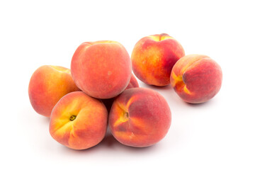 Fototapeta na wymiar Summer fruit background. Ripe juicy peaches on white background. Copy space. Fresh organic fruit vegan food. Harvest concept