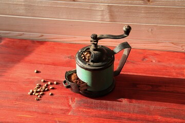 Vintage coffee grinder, ground coffee and coffee beans 