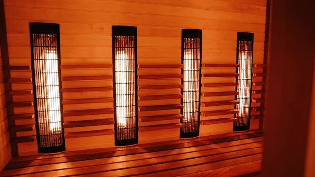 Close up of infrared heater of classic wooden Finnish sauna to improve health and well-being