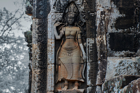 Image of a woman at a Khmer temple. Banteay Samre.