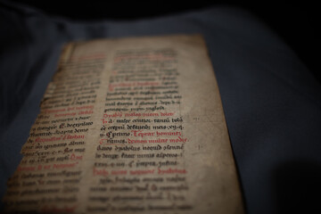 A medieval manuscript on exorcism from a religious text from the C14th. Hand written on vellum in black and red.