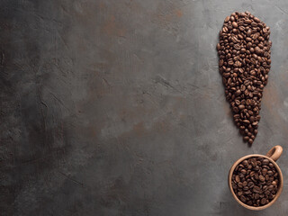 Exclamation point made from roasted coffee beans. Top view, place for tex, copy space.